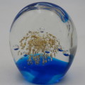 Handmade glass paperweight with bubbles design