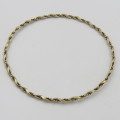 9kt Gold twisted bangle - weighs 4,3 g size - 19 cm