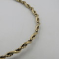 9kt Gold twisted bangle - weighs 4,3 g size - 19 cm