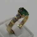 14kt Yellow Gold ring with 4 diamonds totalling 60 points SI / G and emerald of 95 points