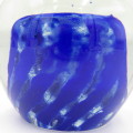 Vintage glass paperweight with blue design