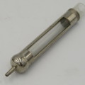 Vintage glass syringe set in metal tin
