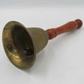 Small brass hand bell with wooden handle
