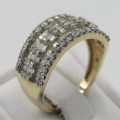 9kt Yellow gold diamond ring with 52 round and 66 baguette diamonds