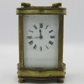 Antique brass carriage clock in original case - runs and stops