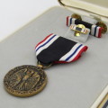 US Prisoner of War honorable service medal and ribbon bars in original box