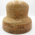 Antique wooden hat form with various markings