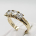 9kt Yellow Gold ring with 4 cubic zirconias - weighs 3,8g - Size O