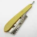 Vintage cut throat straight razor with disposable blade