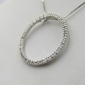 18kt White gold pendant with 34 small diamonds and 9kt gold necklace