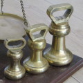 Antique brass balancing scale with set of bell weights