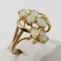 14kt Yellow gold Opal and diamond ring - weighs 3,7g - Size O