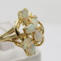14kt Yellow gold Opal and diamond ring - weighs 3,7g - Size O