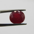 Fracture filled Ruby of 6,2 carat oval mixed cut - dark toned red with Gemlab certificate