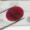 Natural Ruby of 13,8 carat oval checkerboard dark toned slight violet red with Gemlab certificate