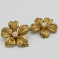 Pair of gold color flower clip on earings