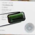 Dark toned Green Tourmaline of 5,59 carat Emerald cut with Gemlab certificate