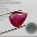 Dark toned slightly purplish red Ruby - fracture filled - 4,92 carat Pear shape