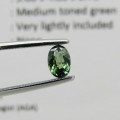 Natural Sapphire of 0,67 carat - Medium toned green - oval mixed cut - with Gemlab certificate