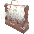 Beautiful Antique tantalus with 3 glass decanters