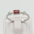 Sterling silver ring with a red stone and two clear stoned- size R 1.8g