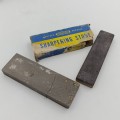 Pair of vintage sharpening oil stones - one broken
