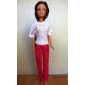 Barbie doll's pink pants and white print T-shirt