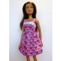 Barbie doll`s pink tulip print dress