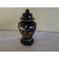 collectable decorative ginger jar on wooden stand