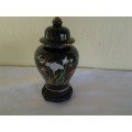 collectable decorative ginger jar on wooden stand