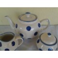 modern but pretty porcelain polka dot tea pot milk and sugar bowl set