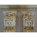 a pair of modern styled decorative wall sconces