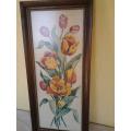 bright and colorful framed behind glass floral tapestry