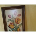 bright and colorful framed behind glass floral tapestry