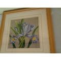 small framed lilac floral tapestry behind glass