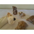 four collectable small ornaments .. dog head .. wade etc