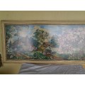 large country side scene tapestry behind glass