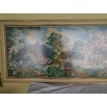 large country side scene tapestry behind glass