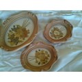 a lot of small pretty hard plastic vintage ornate frames with dried flowers inside