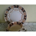 A stunning vintage porcelain Mona tea cup trio