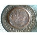 large copper display plate with a horse and carriage scene