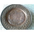 large copper display plate with a horse and carriage scene