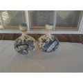 a pair of decorated blue and white porcelain decanters ? display bottles