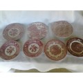eight assorted pretty red and white porcelain side plates