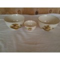 a set of three vintage hayride pattern porcealin sugar bowls