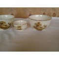 a set of three vintage hayride pattern porcealin sugar bowls