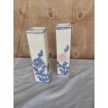 A pair of tall procelain floarl vases