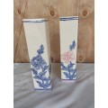 A pair of tall procelain floarl vases