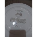 Four Wedgwood dinner plates