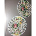 A pair of procelain floarl plates